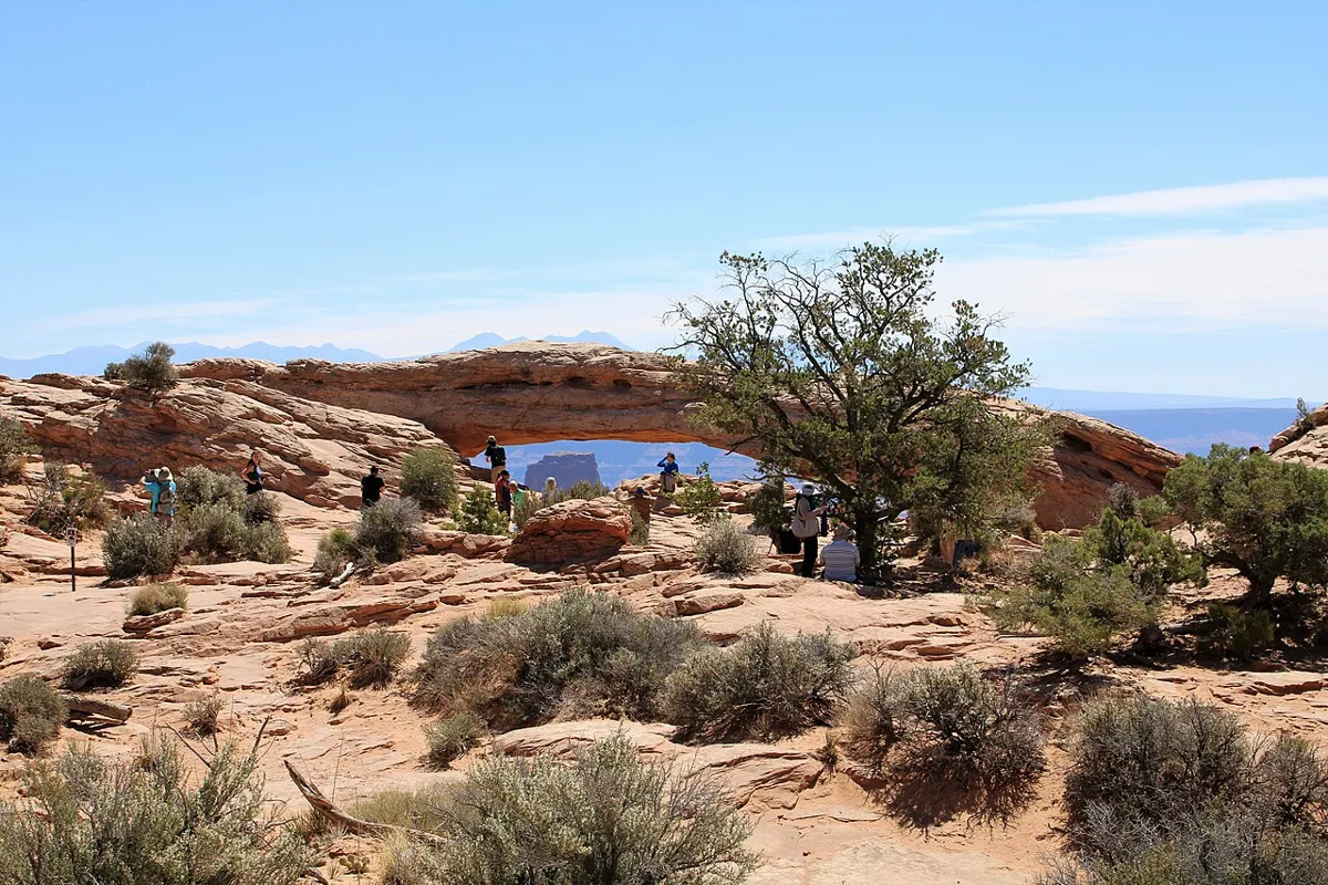 Mesa Arch framing distant mountains in Canyonlands National Park