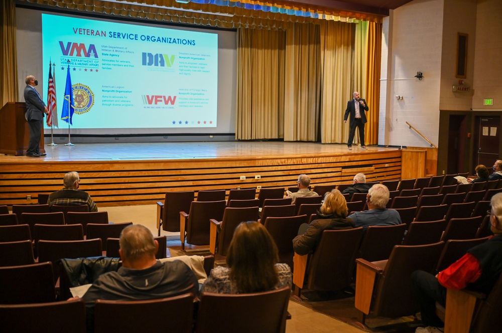 Audience members attend a veterans-services presentation during Cory Pearson's keynote at Hill Air Force Base.