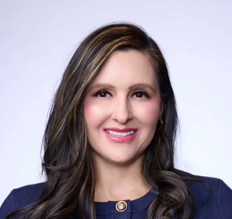 Official-page portrait of Dea Theodore