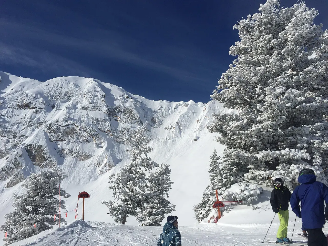 Snowy ski slopes under a clear February sky at Snowbasin Resort