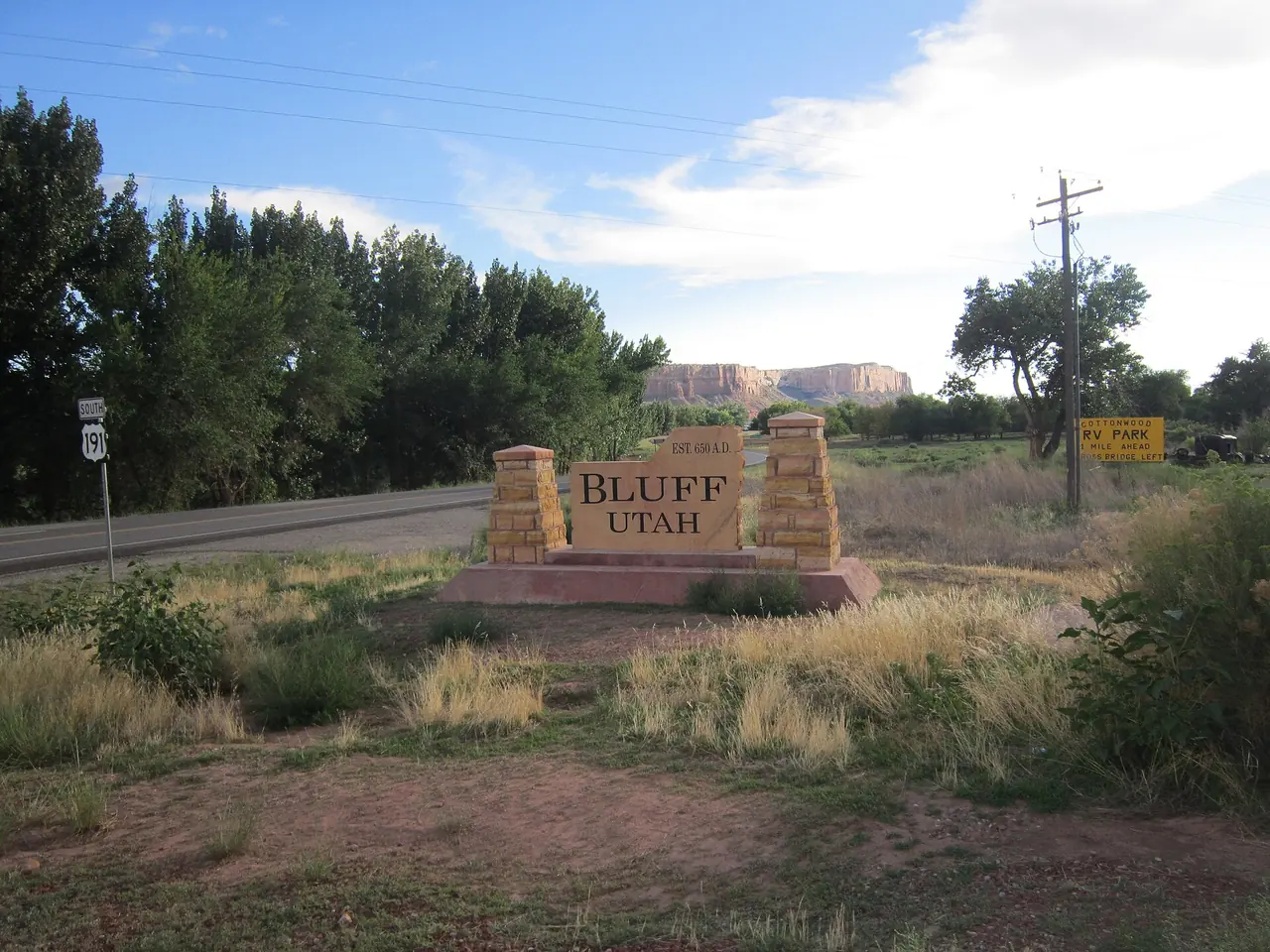 The small town of Bluff seen from the east, beneath sandstone bluffs along the San Juan River