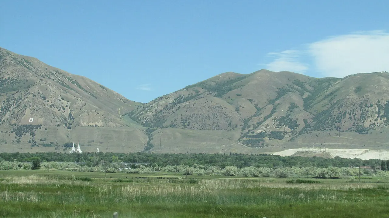 Green valley floor and mountain slopes near Brigham City