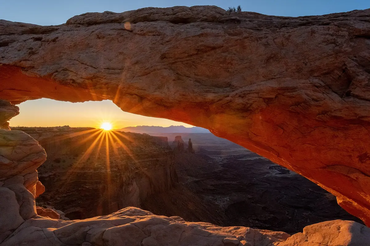 Sunrise starburst through Mesa Arch, Canyonlands National Park