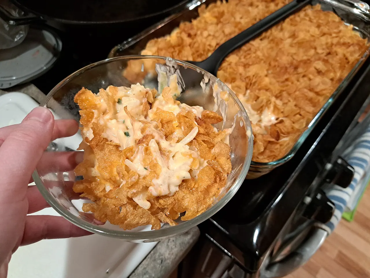 A baked dish of funeral potatoes, the cheesy potato casserole that is a Utah classic