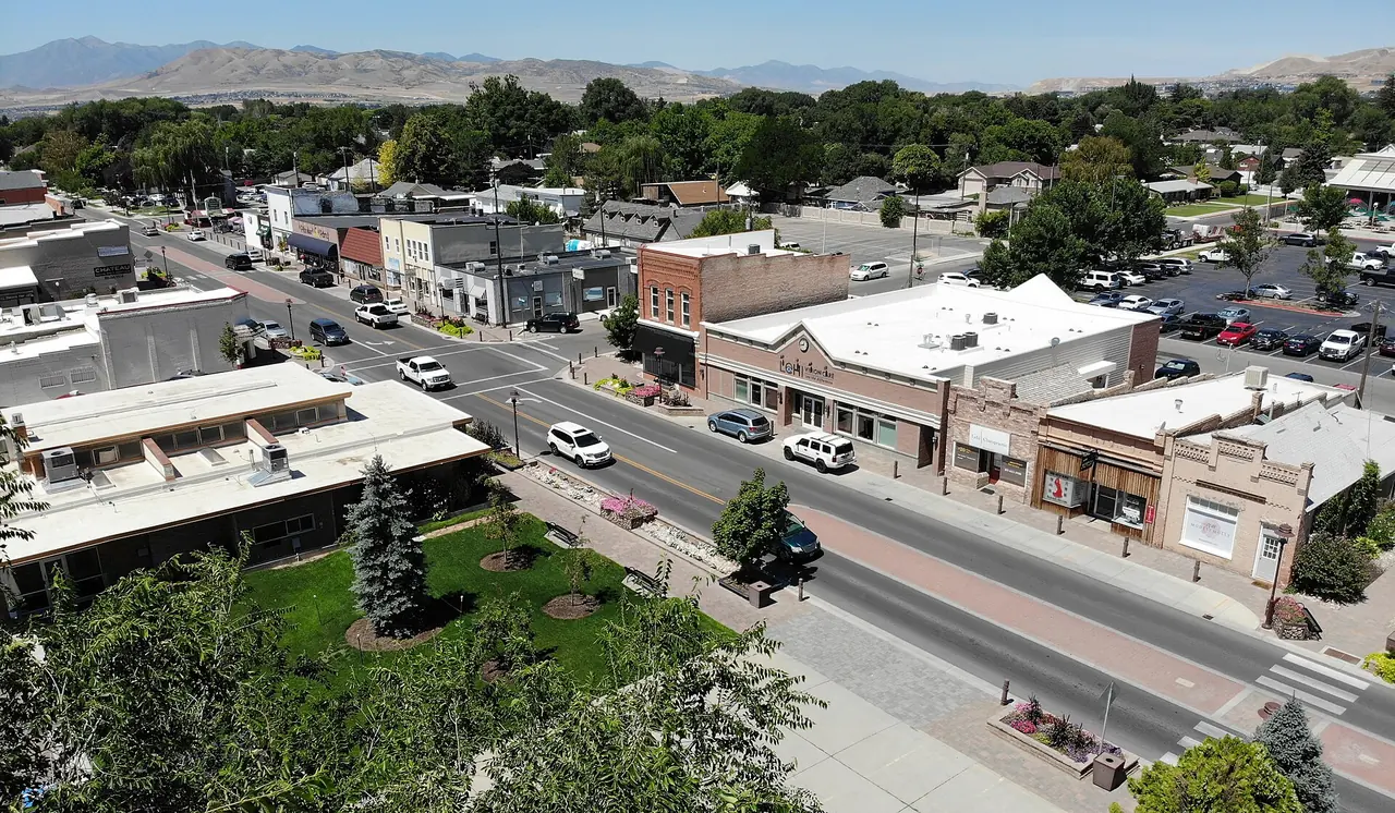 Aerial view of Lehi's historic Main Street district with the Wasatch Mountains behind